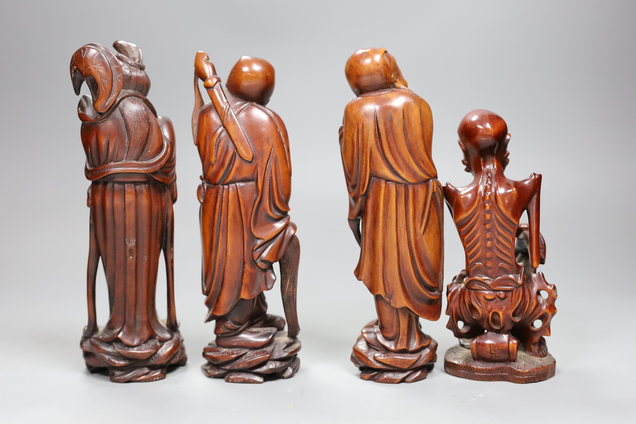 Four Chinese boxwood figures of a luohan and three immortals, early 20th century, tallest 20cm high